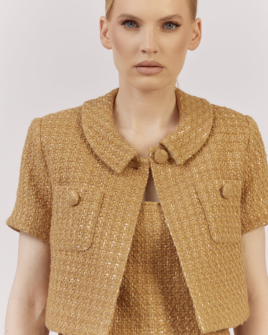 Cropped short-sleeve blazer in a textured wool-viscose blend with a relaxed oversized fit and classic turned-down collar