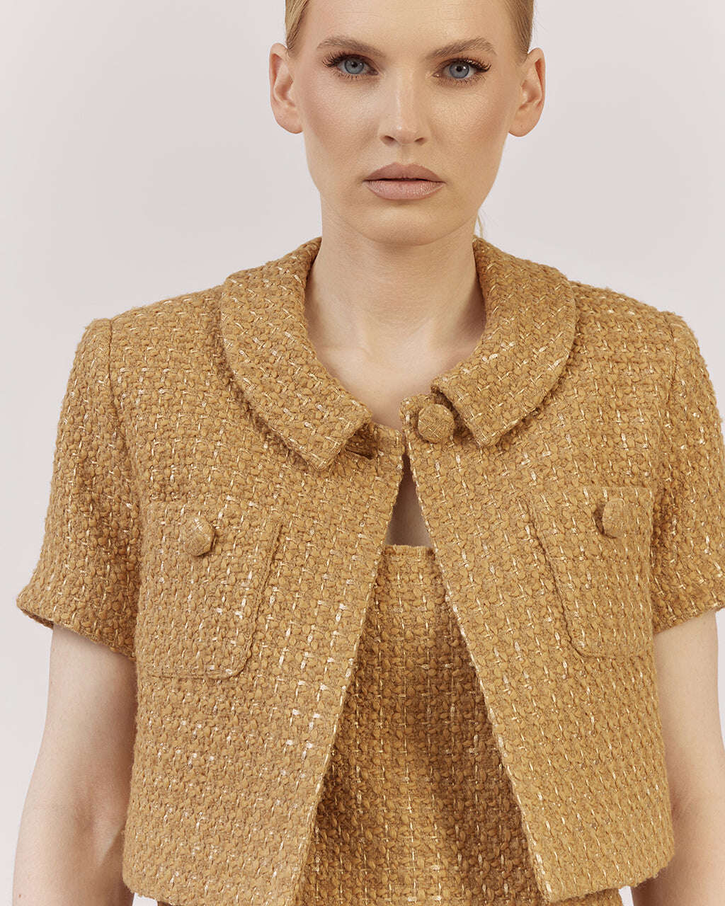 Cropped short-sleeve blazer in a textured wool-viscose blend with a relaxed oversized fit and classic turned-down collar