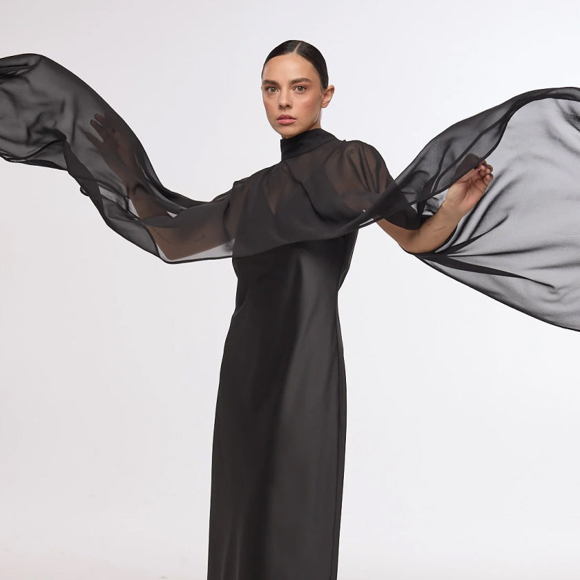 Which designer dresses women choose for a timeless wardrobe?