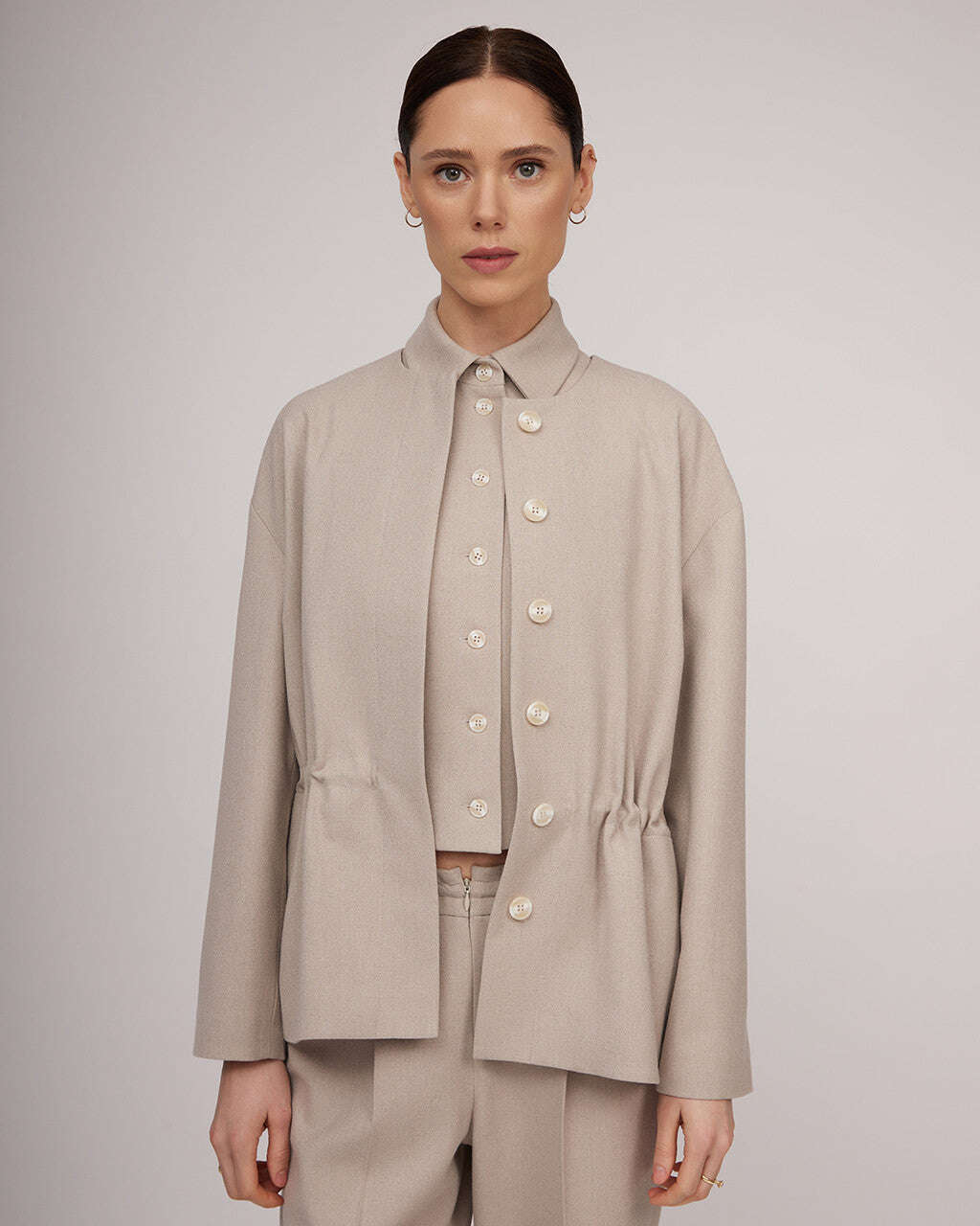 Light beige tweed jacket with a cinched waist | NERINA Nolo Store