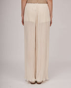 Elegant transparent pleated pants in beige tone with an elastic waistband and jersey shorts | ELDA Nolo Store