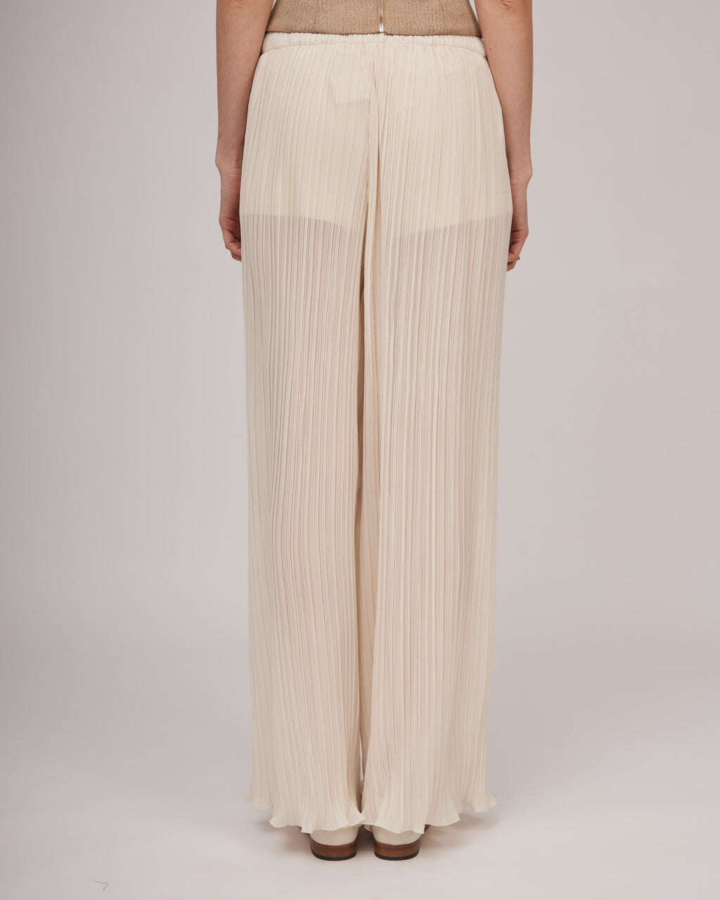 Elegant transparent pleated pants in beige tone with an elastic waistband and jersey shorts | ELDA Nolo Store