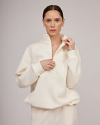 Cream-colored jersey knit sweater with a slight texture and zipper closure | KATIA