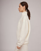 Cream-colored jersey knit sweater with a slight texture and zipper closure | KATIA