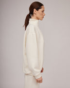Cream-colored jersey knit sweater with a slight texture and zipper closure | KATIA