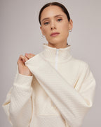 Cream-colored jersey knit sweater with a slight texture and zipper closure | KATIA