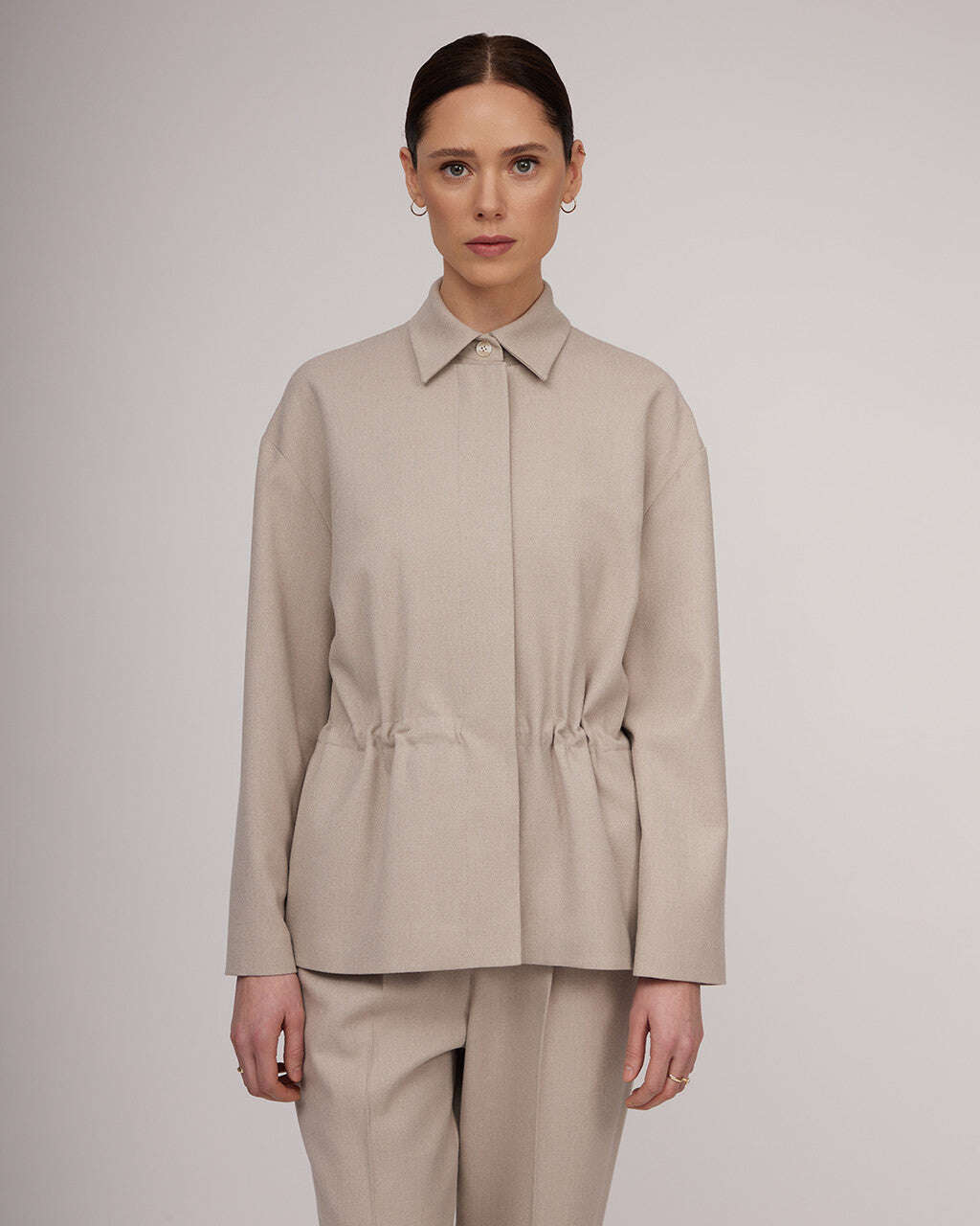 Light beige tweed jacket with a cinched waist | NERINA Nolo Store